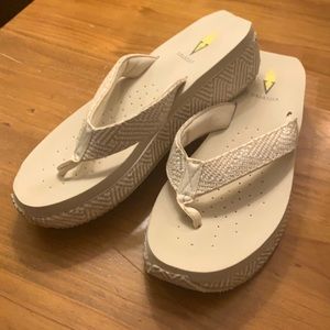 Volatile tan and white sandal